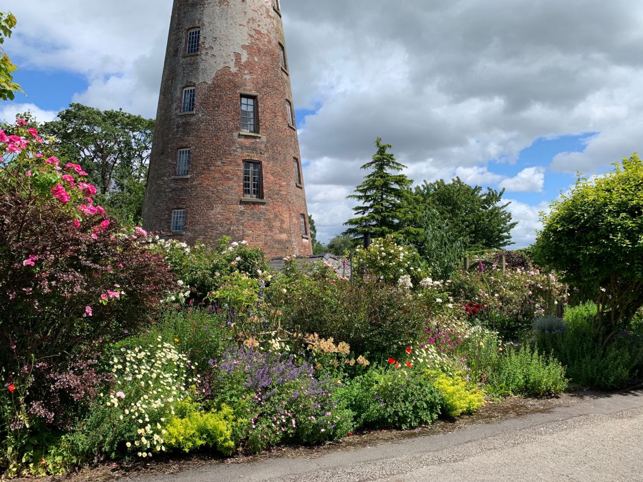 Deep herbaceous border with classic backdrop