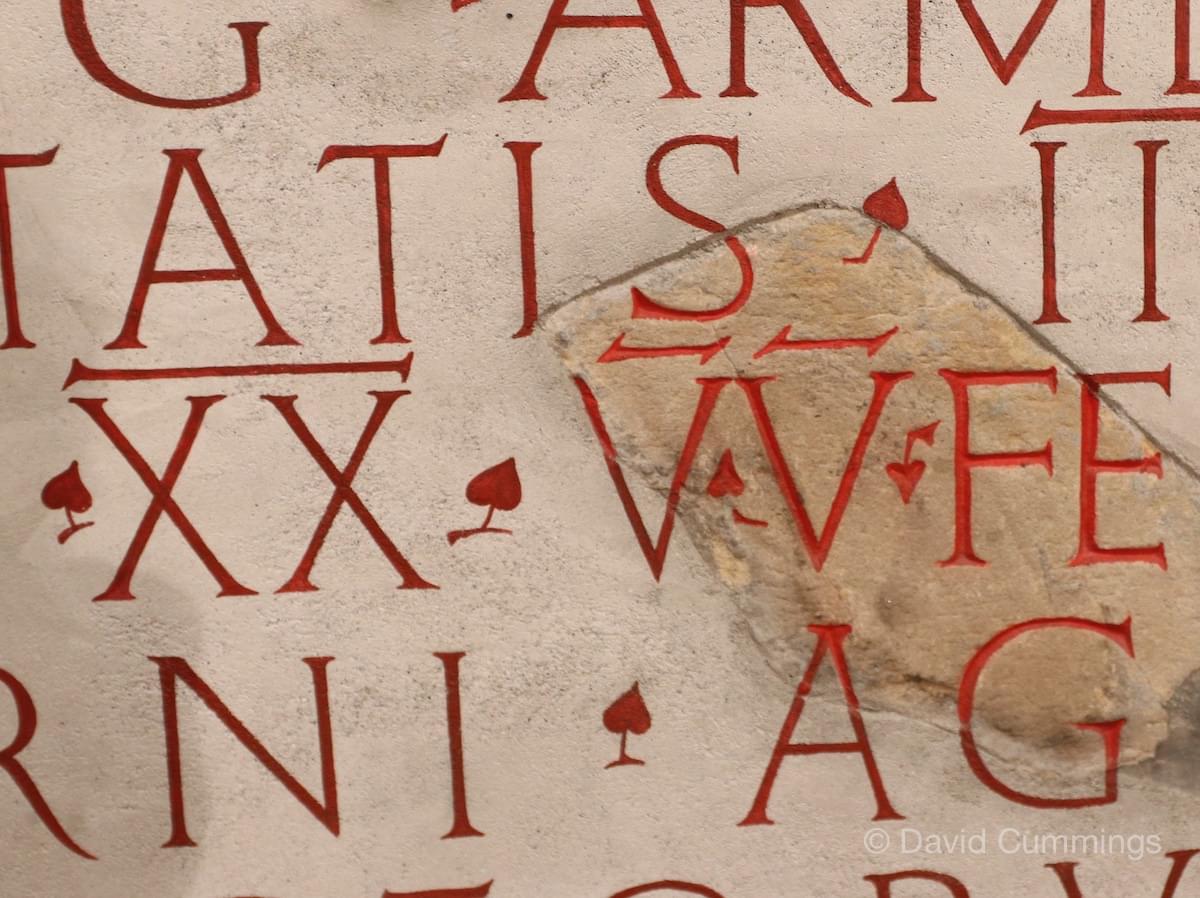 XX VV inscibed on a panel