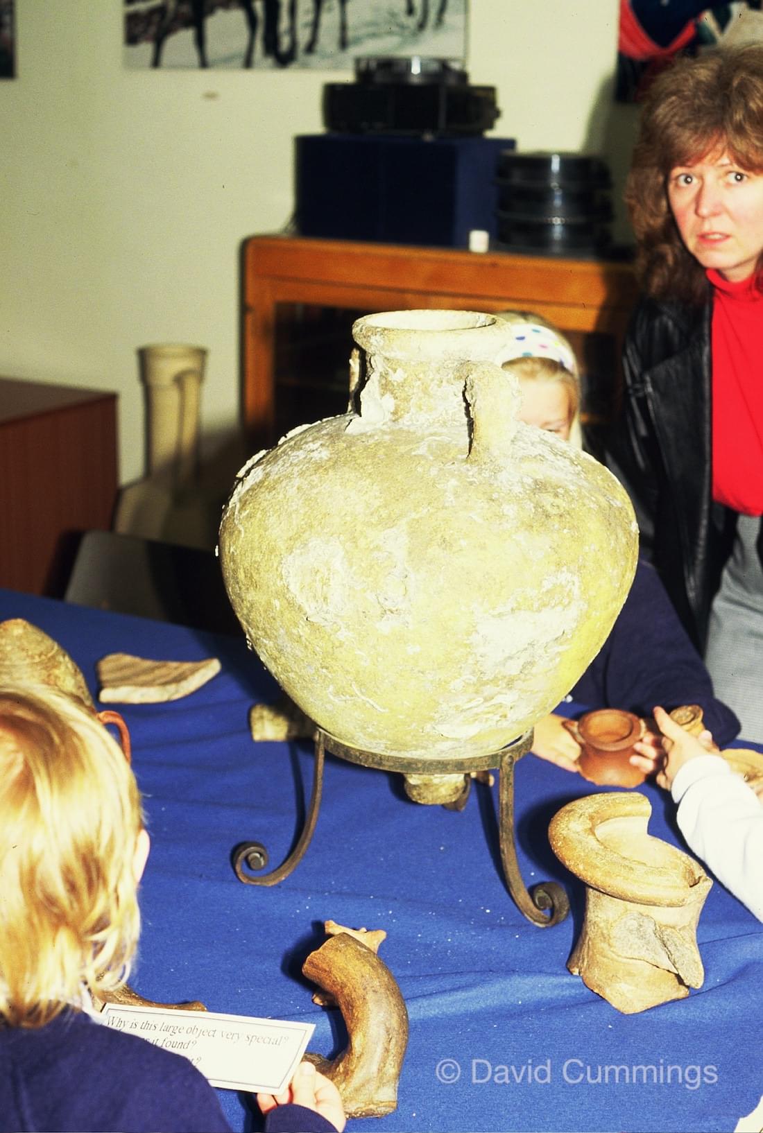 Children studying an amphora at Museum