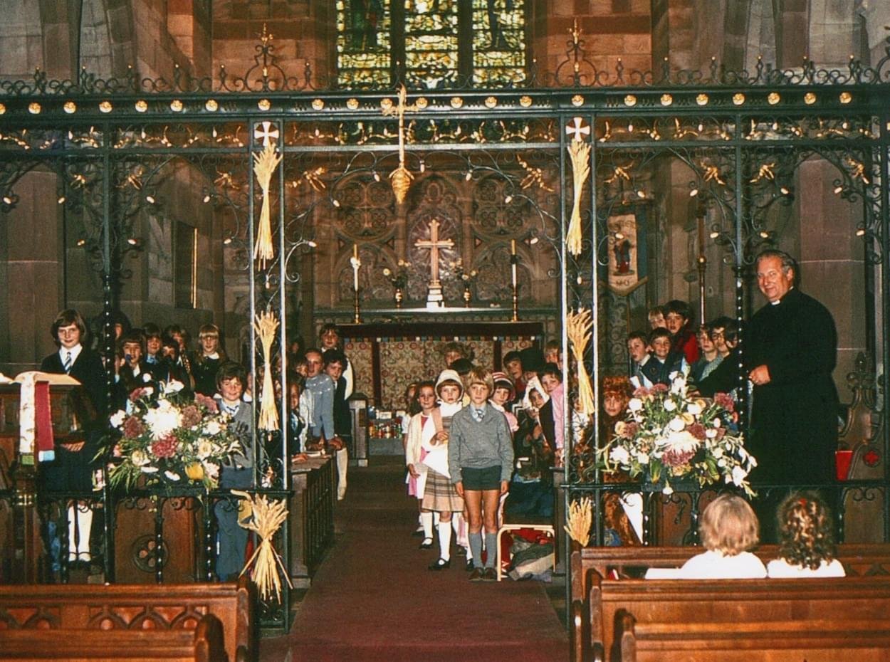 Rector Charles Mack at the Christleton School Harvest Service 1980's