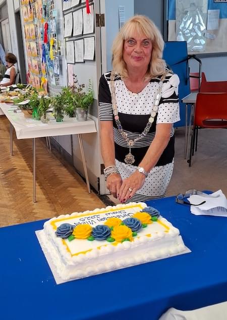 Mrs Margaret Parker cutting Christleton Village Show Cake 2025
